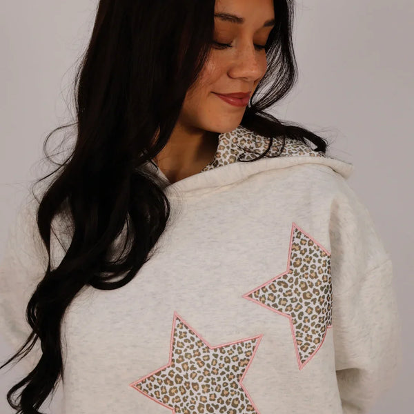 Sudadera con capucha y estrellas animal print